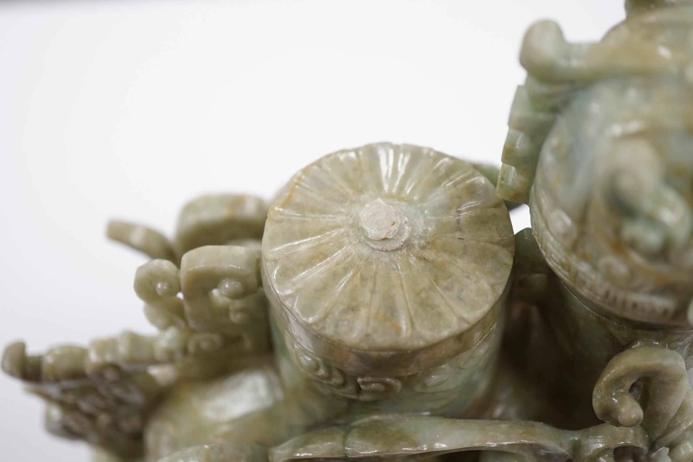 A large Chinese archaistic jadeite ‘phoenix’ vessel and cover, wood stand, 22cm high. Condition - fair